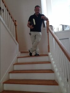 ian inspecting the completion of wooden stairs