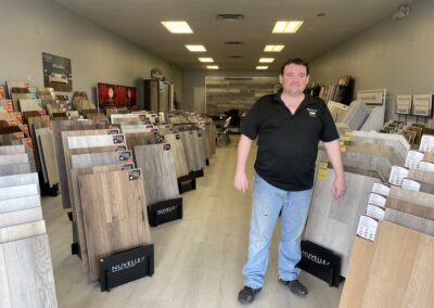 tricolor flooring sample display with brian in our showroom